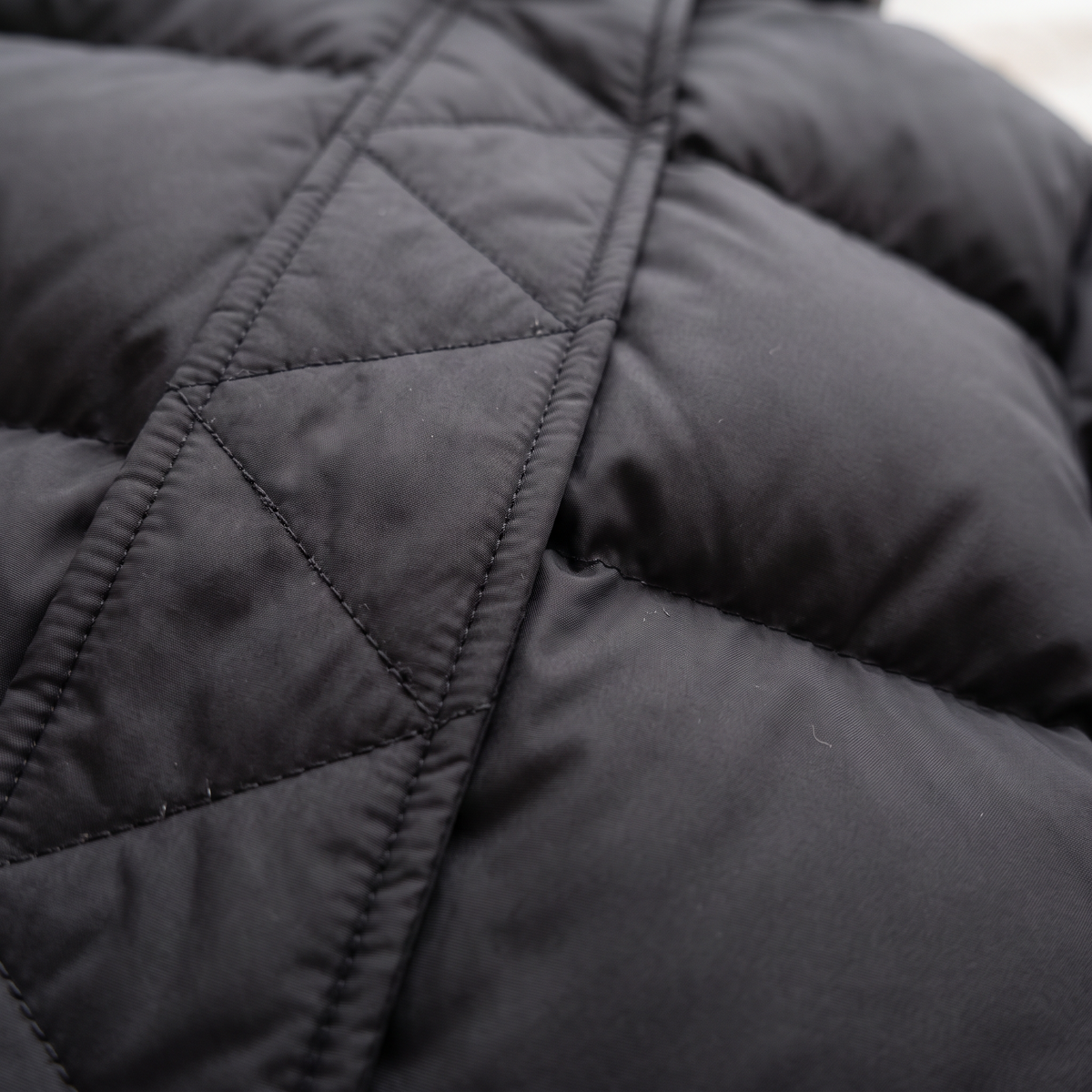 Quilted Hooded Puffer Jacket - Black - fabric close-up